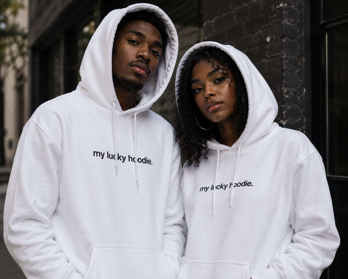 Couple in matching white MY LUCKY hoodies